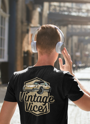 Back view of black Badges T-Shirt by Vintage Vices, male model, headphones